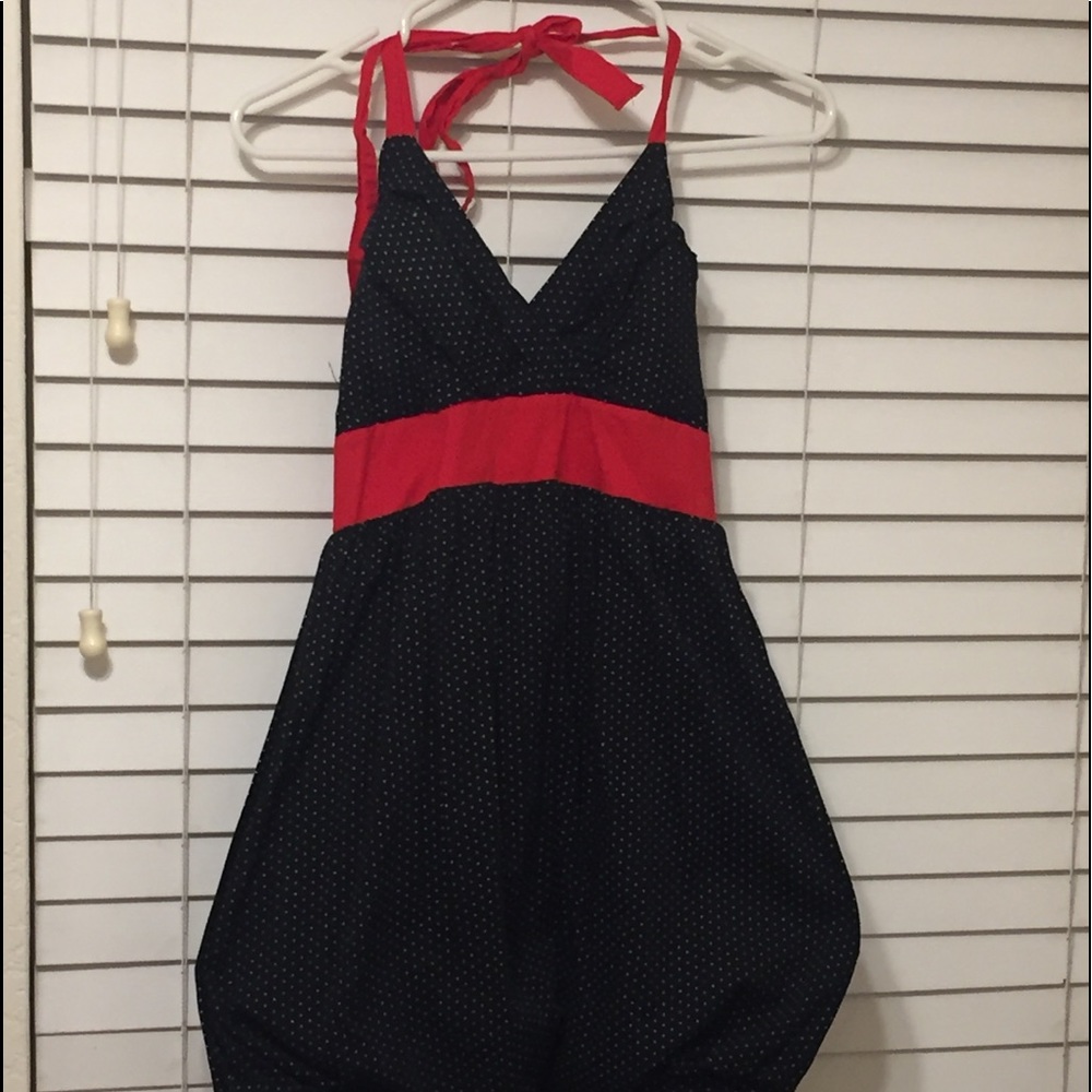 Used polkadot dress with red tie in the back.